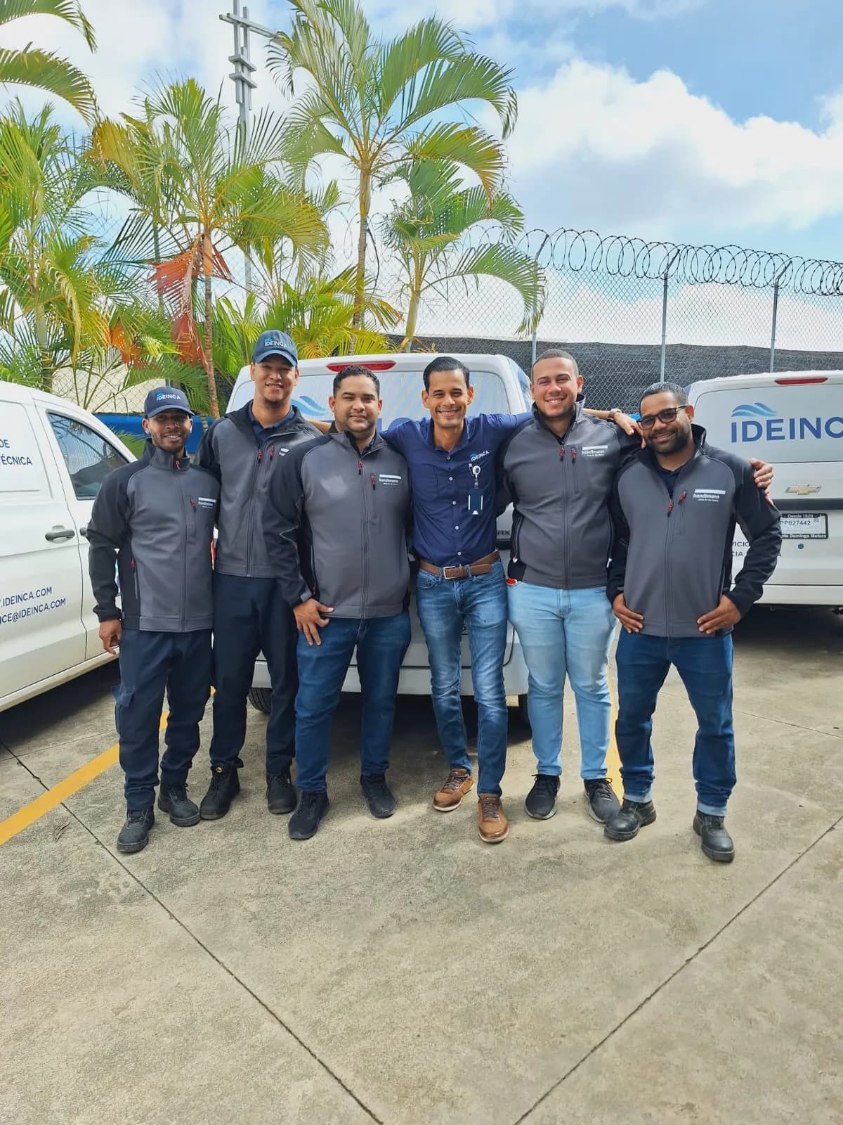 The IDEINCA technical service team beside the company fleet